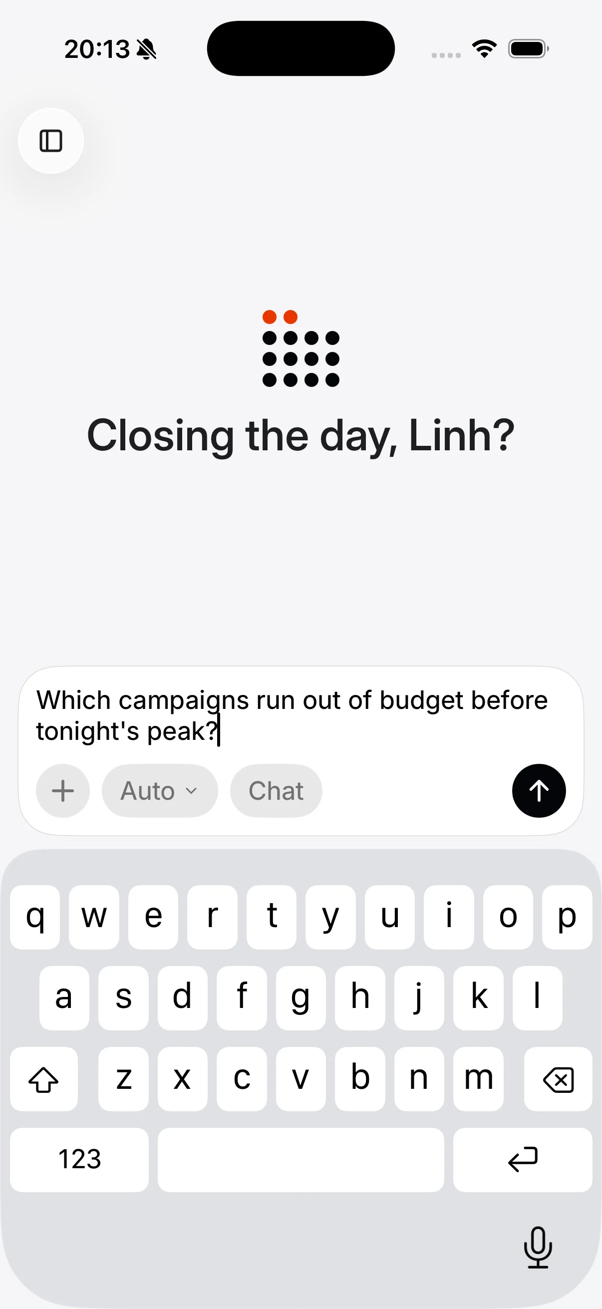 The Epsilo iOS console on a phone: the keyboard is up and the operator is typing "Which campaigns run out of budget before tonight's peak?" into the composer